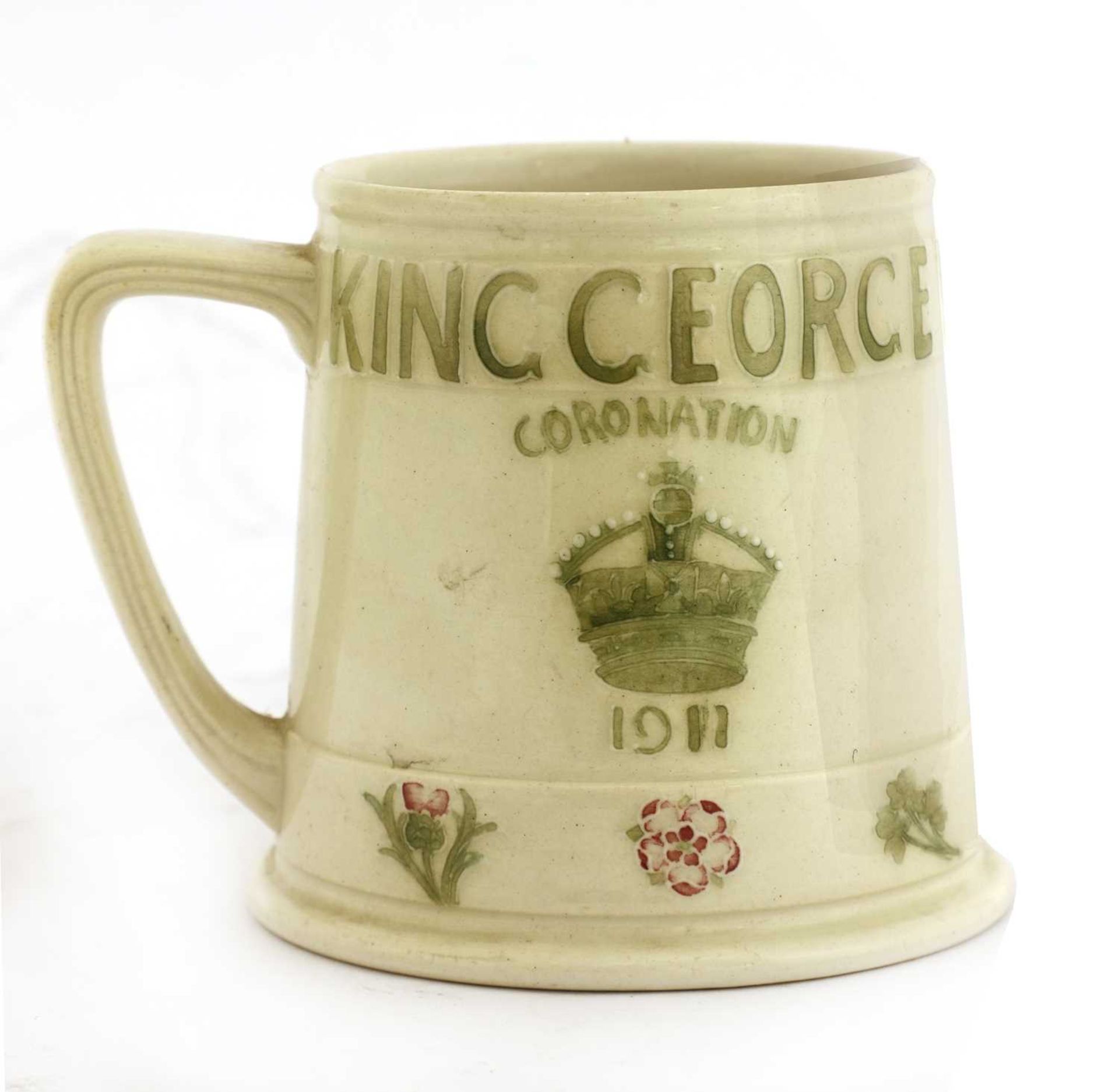 A Moorcroft 1911 Coronation of King George V and Queen Mary mug,