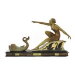 An Art Deco patinated spelter centrepiece of a lady,