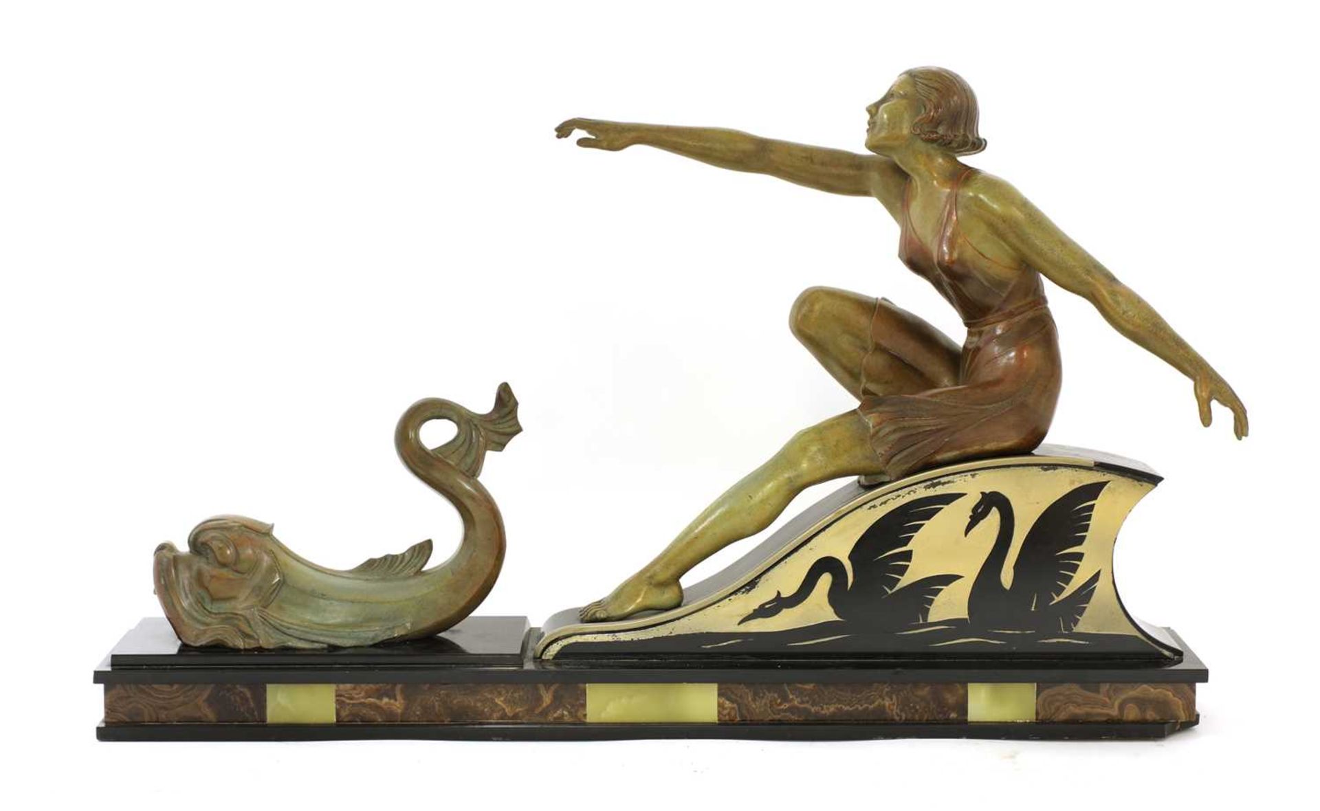 An Art Deco patinated spelter centrepiece of a lady,