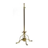 An Arts and Crafts brass standard lamp,