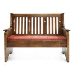 An Arts and Crafts oak settle,