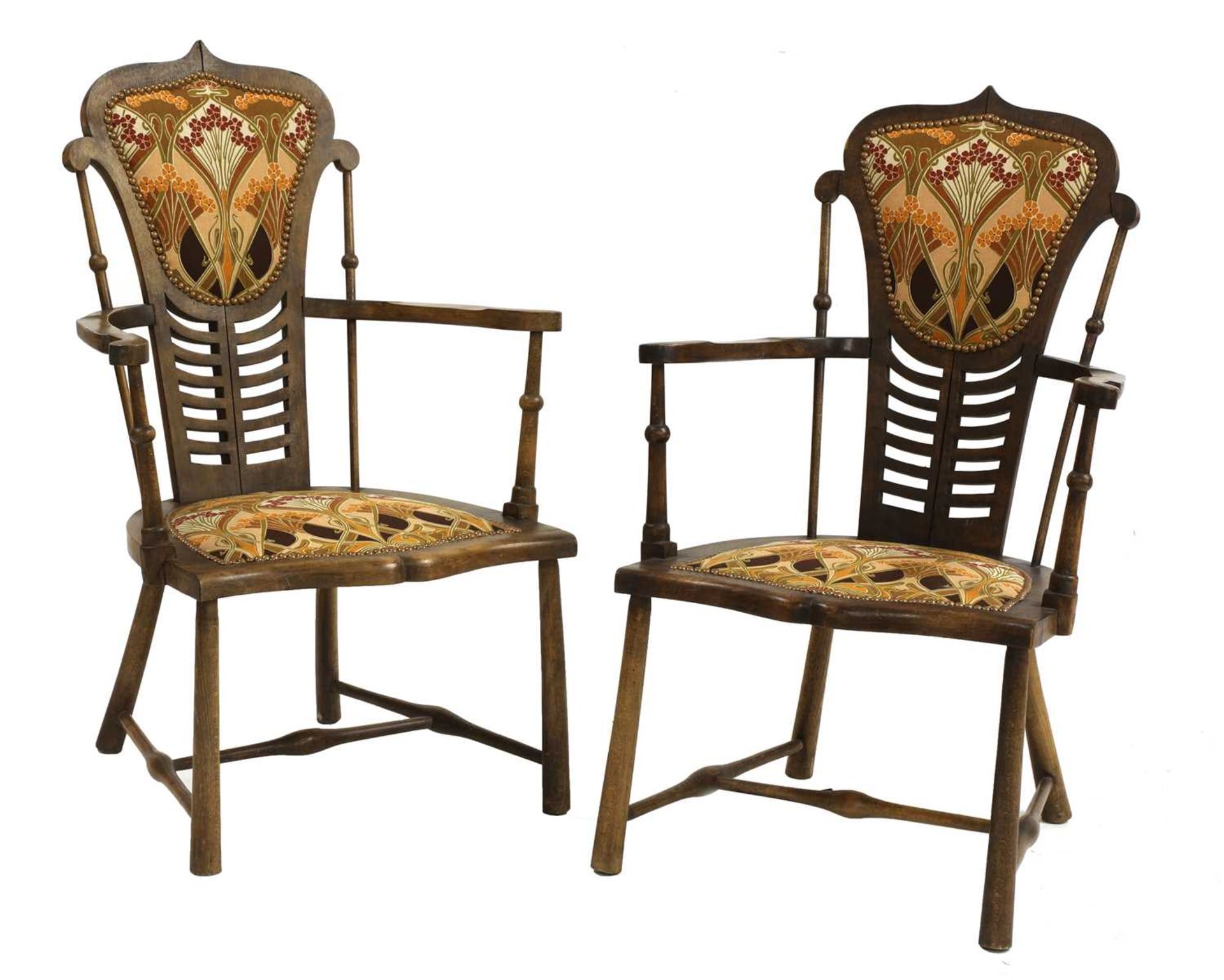 A pair of Art Nouveau mahogany and beech armchairs,