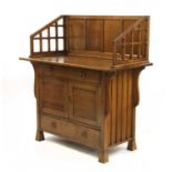 An Arts and Crafts oak cabinet,