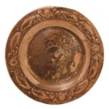 An Arts and Crafts circular copper charger,