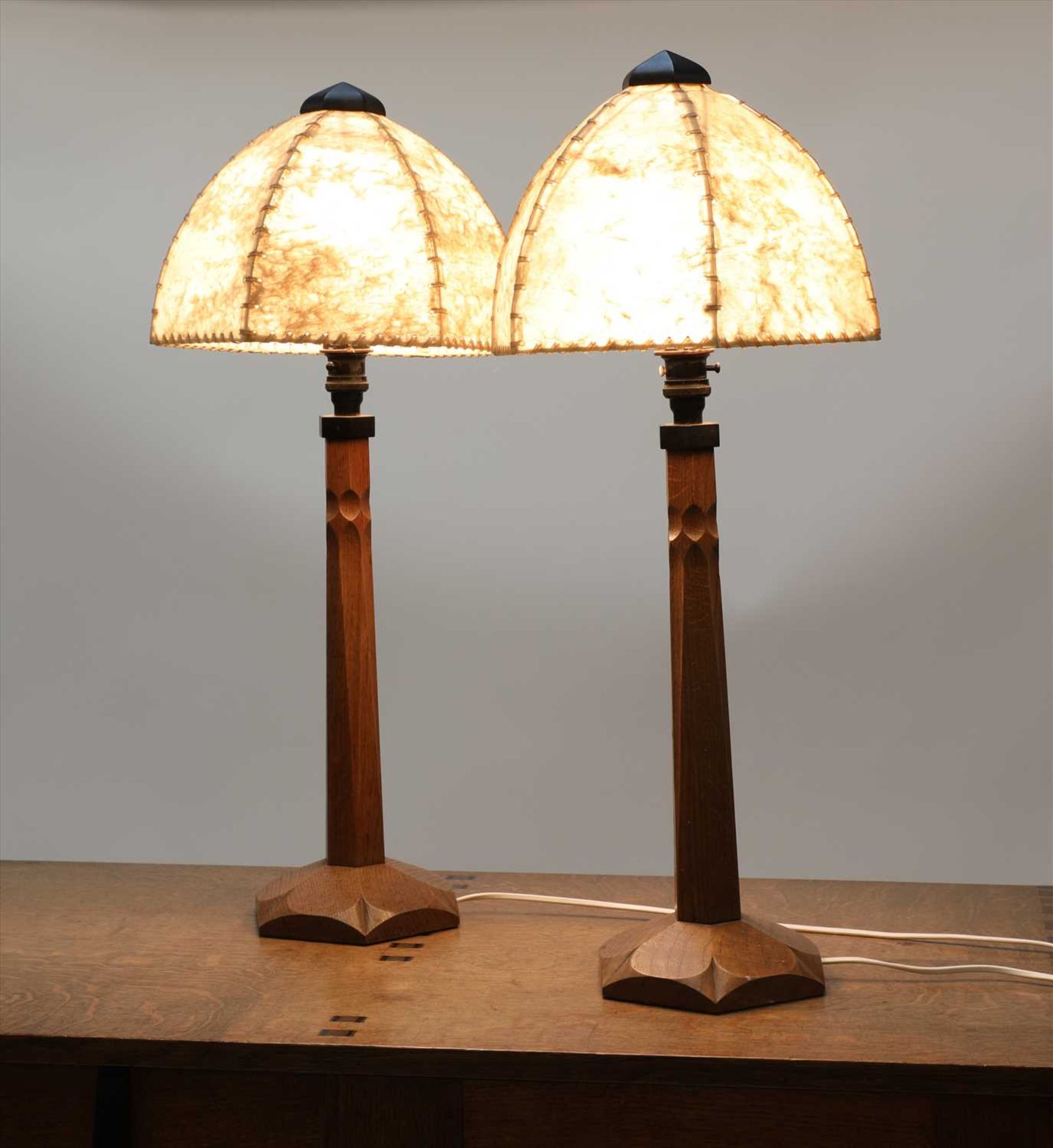 A pair of oak table lamps,