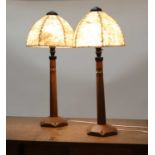 A pair of oak table lamps,