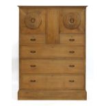 A chestnut 'owl' cabinet,