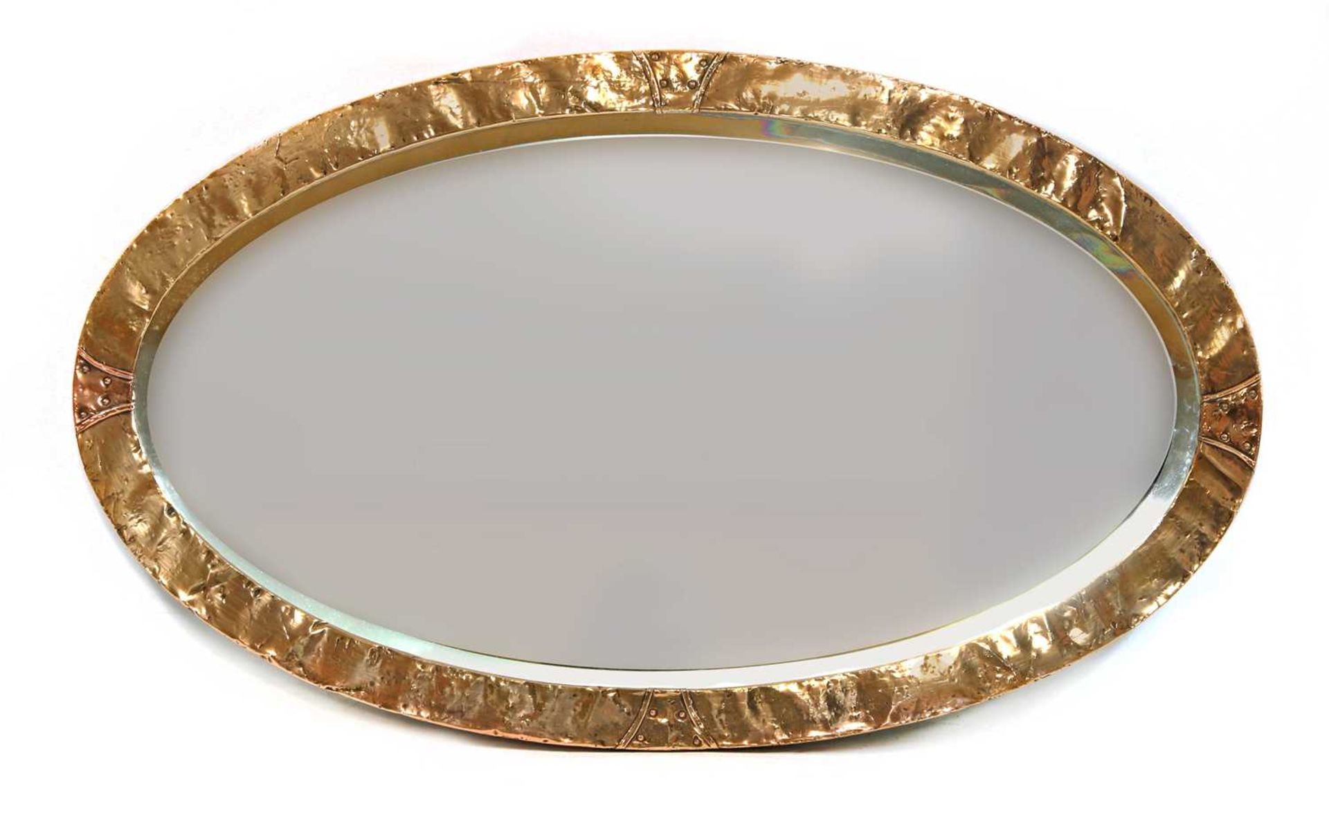 An Arts and Crafts oval copper mirror,