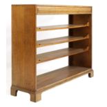 An oak Cotswold School open bookcase,