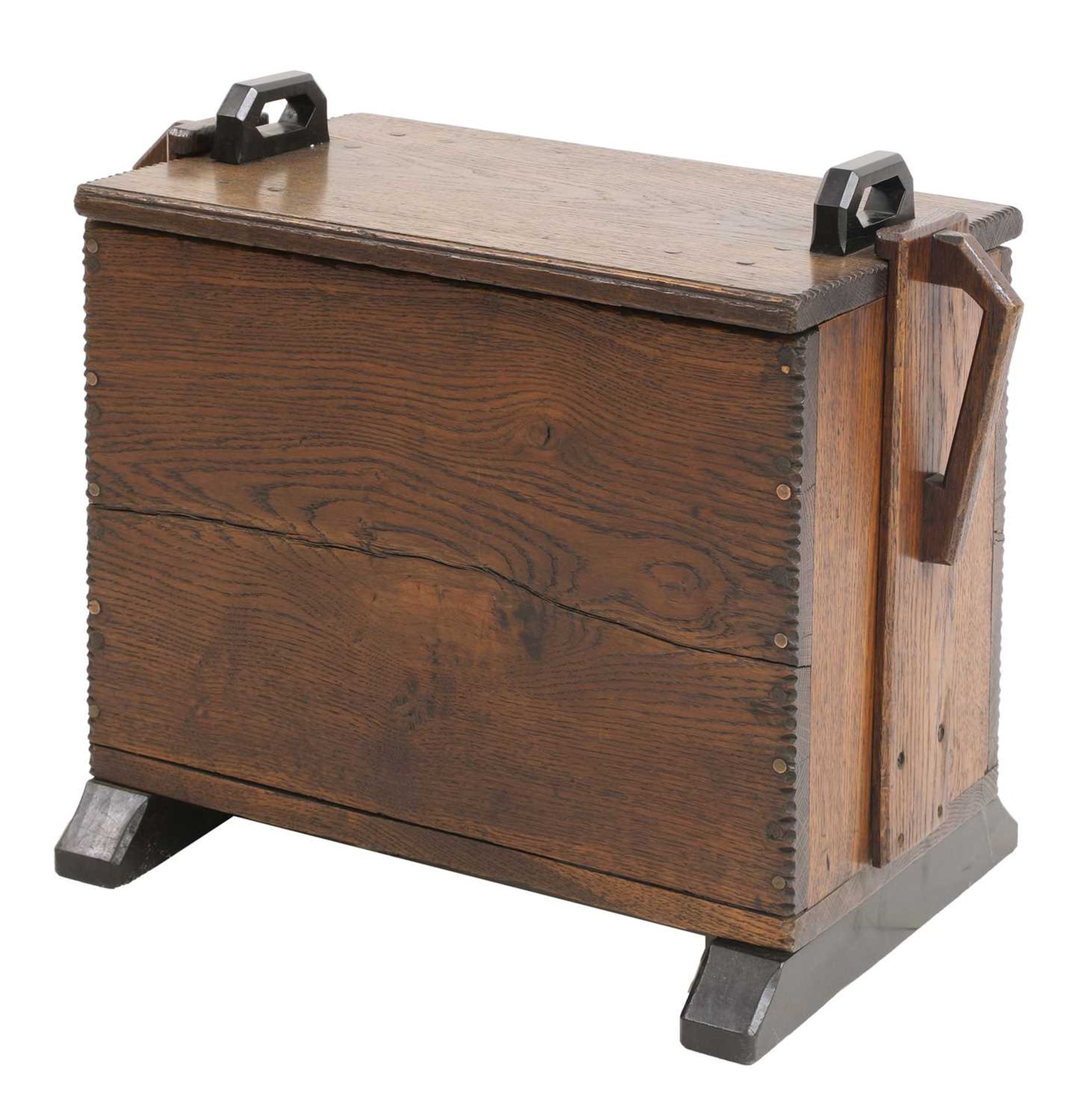 An Arts and Crafts Cotswold School oak log box,