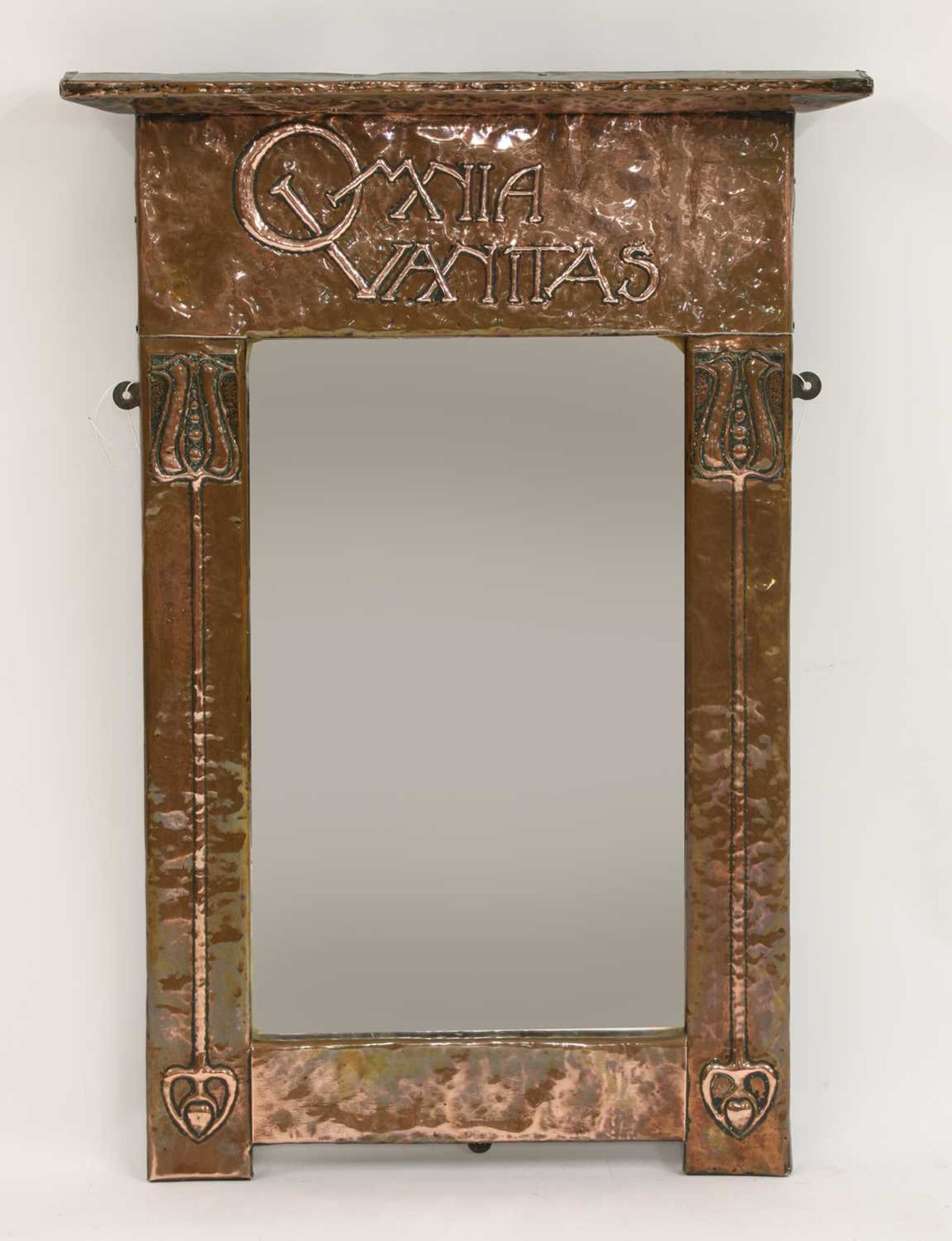 An Arts and Crafts copper wall mirror,