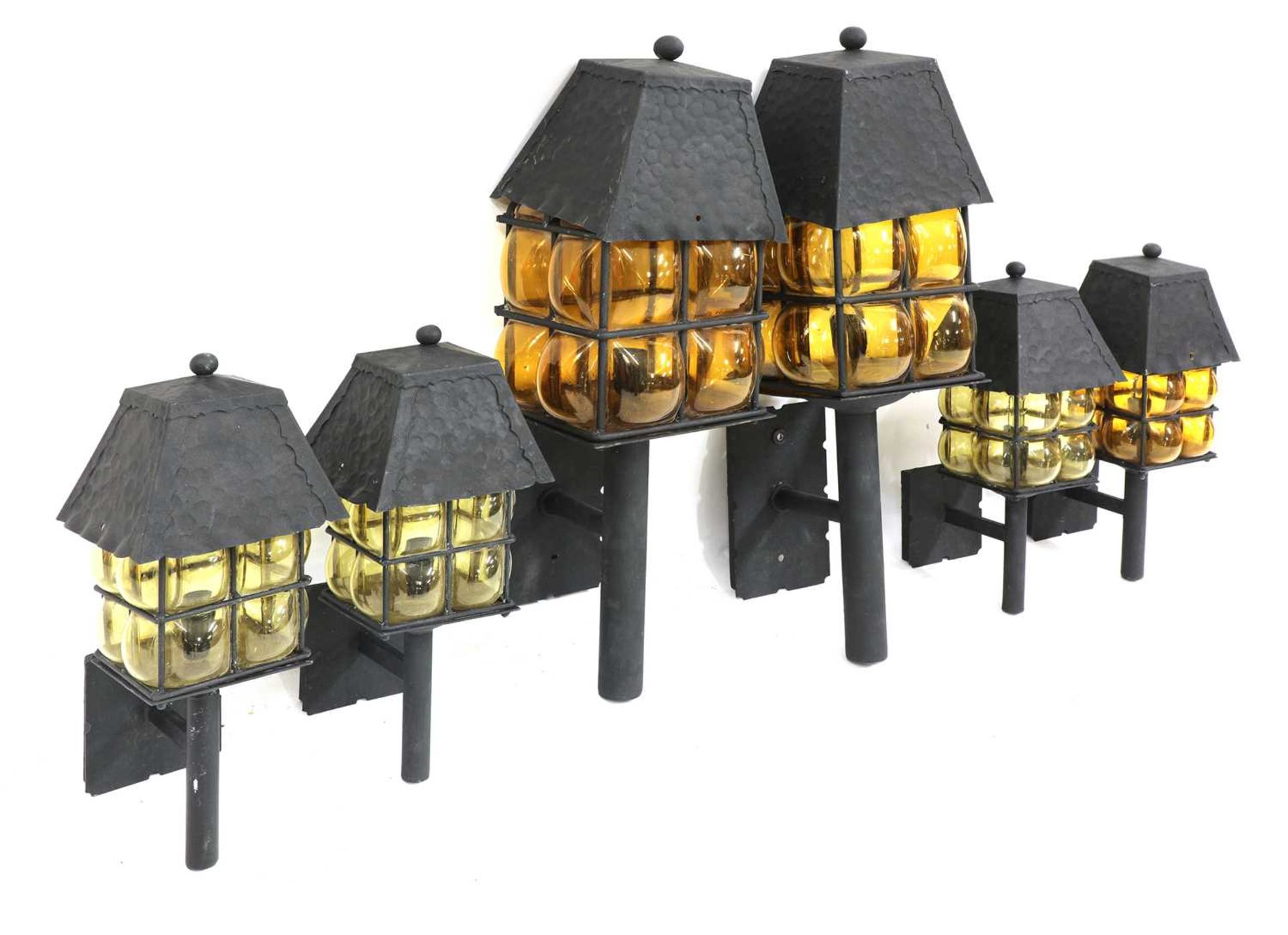 A set of six Arts and Crafts wall lanterns,