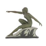 An Art Deco spelter figure of a lady,