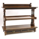 A burr oak and ebonised three-tier buffet,