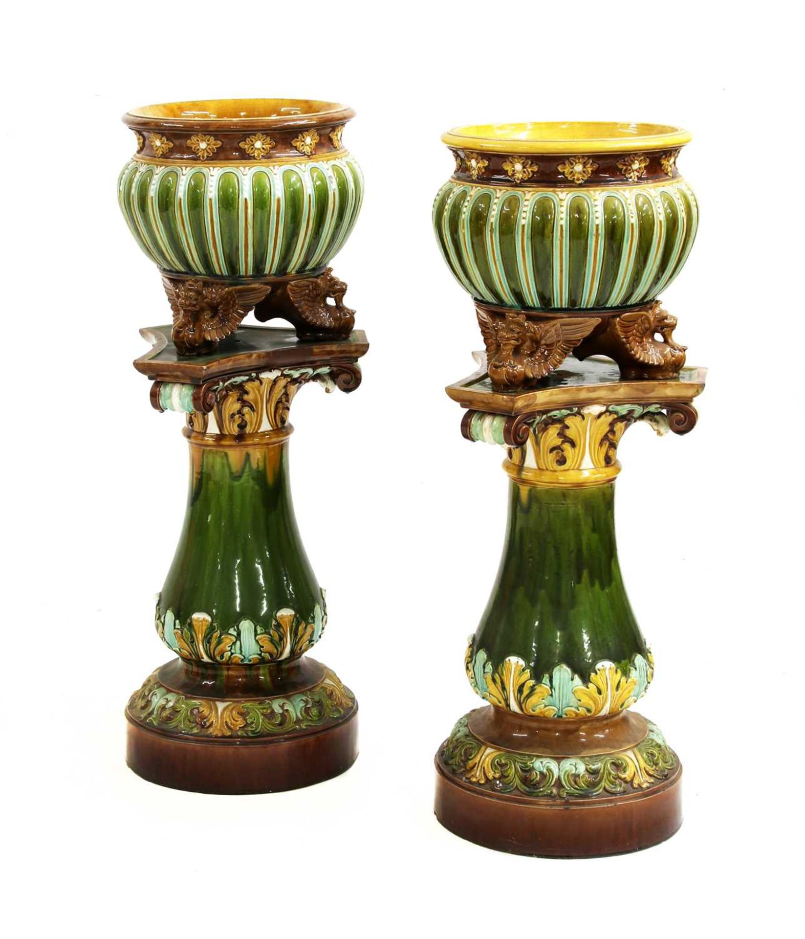 A pair of Doulton Lambeth stoneware jardinières on stands,