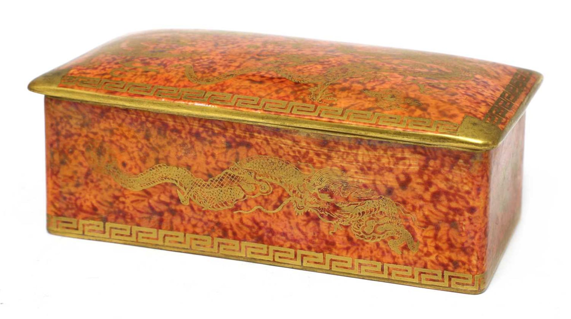A Wedgwood 'Celestial Dragon' orange lustre cigarette box and cover,