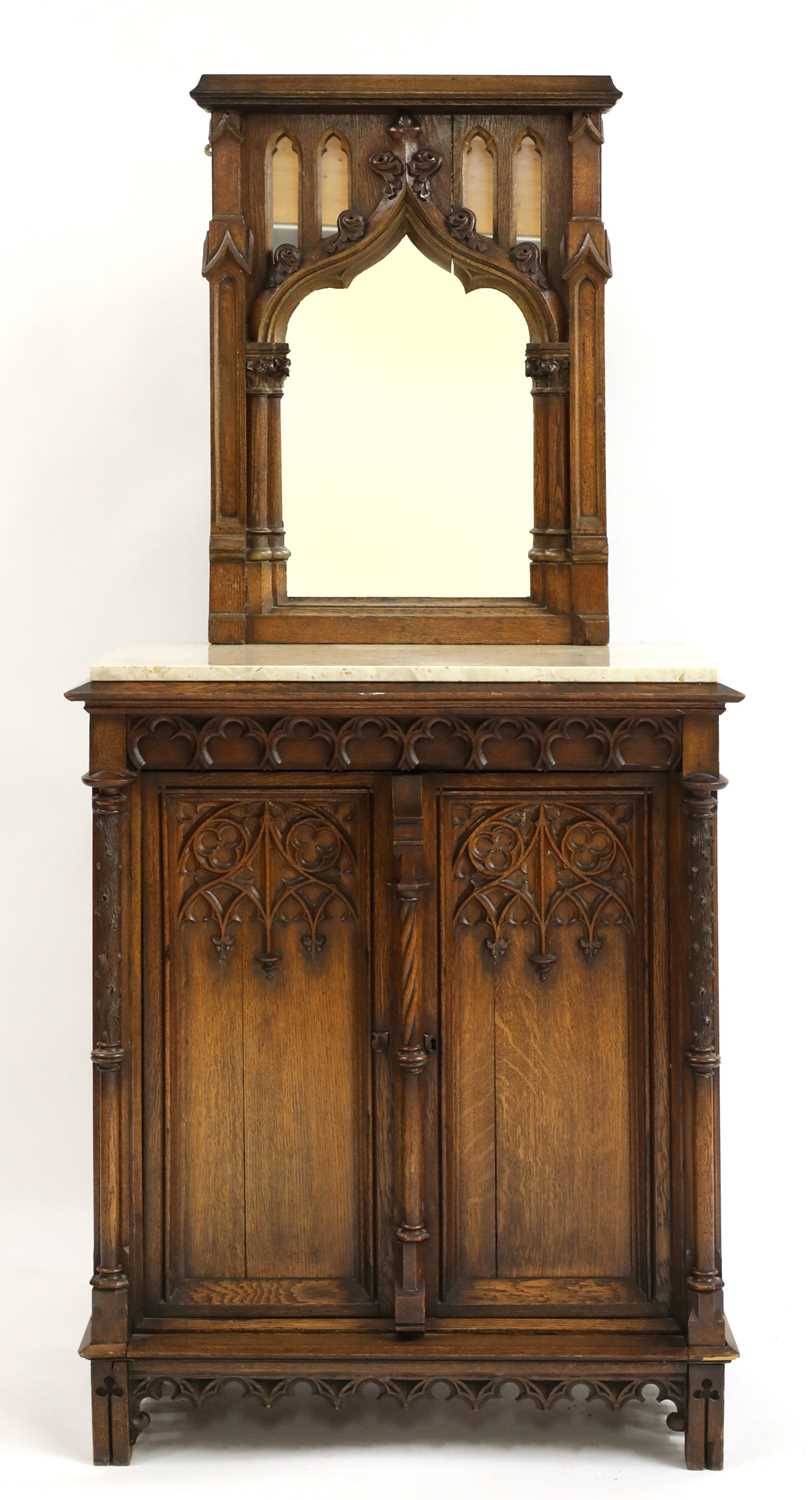 A German carved oak side cabinet,