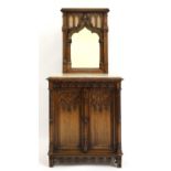 A German carved oak side cabinet,