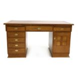 An oak pedestal desk,