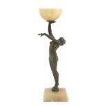 An Art Deco patinated spelter and onyx figural table lamp,