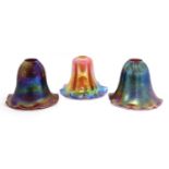 A composed group of three Art Nouveau-style glass shades,