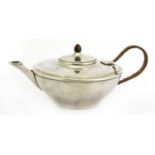 A silver teapot,