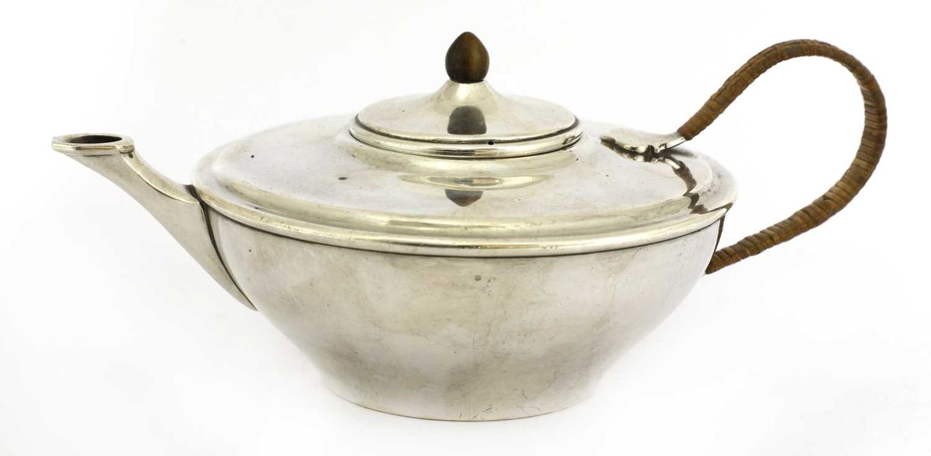 A silver teapot,