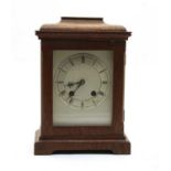 An Edwardian oak mantel clock