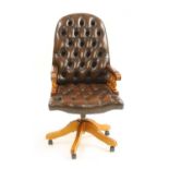 A modern buttoned leather upholstered high back office chair,