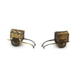 A pair of Japanese sterling silver and silver gilt miniature rickshaws,