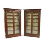A near pair of early 20th century mahogany glazed bookcases,