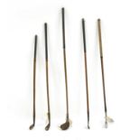 A mixed set of vintage hickory shafted golf clubs comprising,