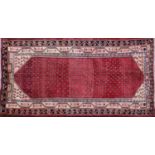 A Persian wool rug,