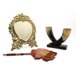 A Continental brass framed heart shaped easel mirror decorated with acorns and oak leaves,