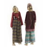 Two life-sized Burmese carved and painted wooden puppets,