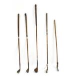 A mixed set of vintage hickory shafted golf clubs,