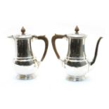 A silver coffee pot and water pot,
