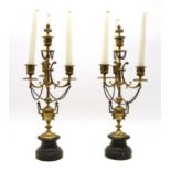 A pair of brass candelabra