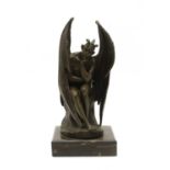 A bronze figure depicting the Devil in thoughtful pose