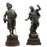 After Ch. Perron, a cast metal figure of an Indian figure carrying a staff,