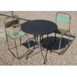 A circular garden table and two chairs,