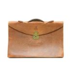 A brown leather document briefcase by John Peck and Son,