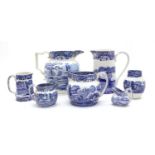 A large collection of Copeland Spode blue and white Italian ware jugs of varying sizes,