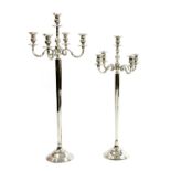 A pair of contemporary large graduated floor standing five branch candelabra,