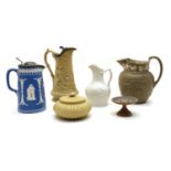 A collection of seven VIctorian pottery relief-moulded jugs