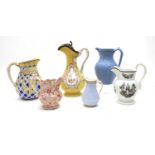 A collection of twelve pottery jugs,