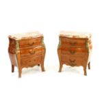 A pair of petite commodes,