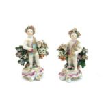 A pair of Continental putti figures,