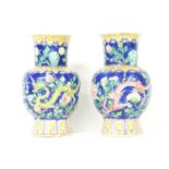 A pair of Chinese famille rose vases,