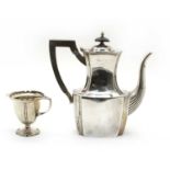 A silver hot water pot,